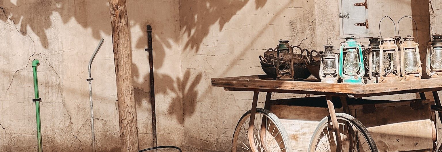 Wagon with lamps in front of natural building in Dubai